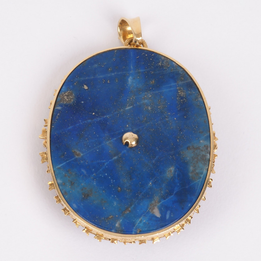 Large gold pendant with lapis lazuli