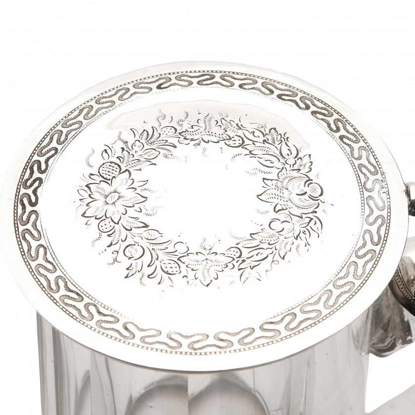 Glass beer mug with silver lid