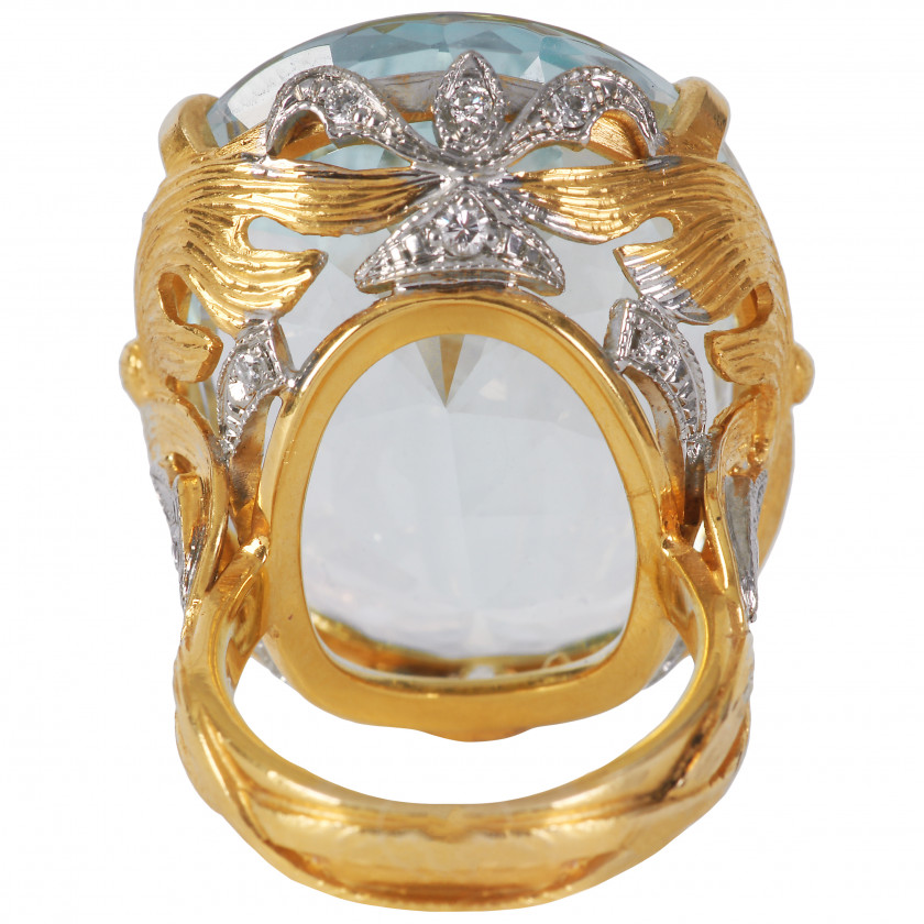 Gold ring with large aquamarine and diamonds
