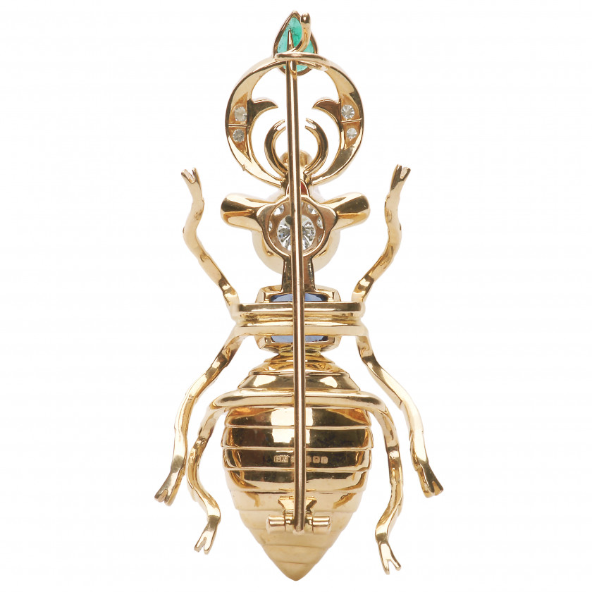 Gold brooch with precious stones in the shape of a beetle