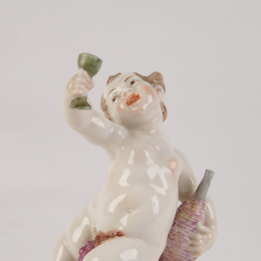 Porcelain figure "Putto on a wine barrel"
