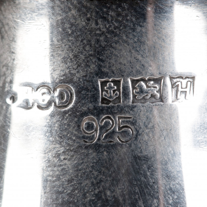 A pair of silver salt and pepper shakers