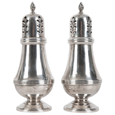 A pair of silver salt and pepper shakers