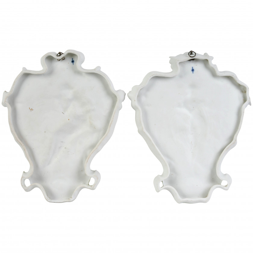 A pair of porcelain wall plaques in Art Nouveau style