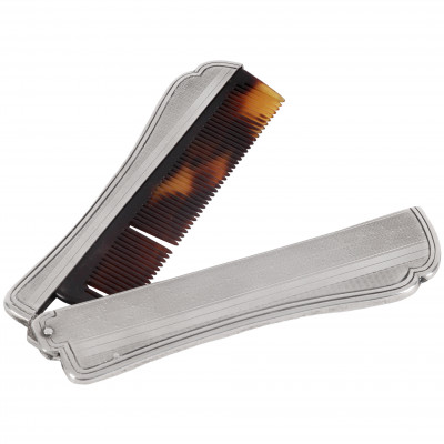 Silver travelling comb