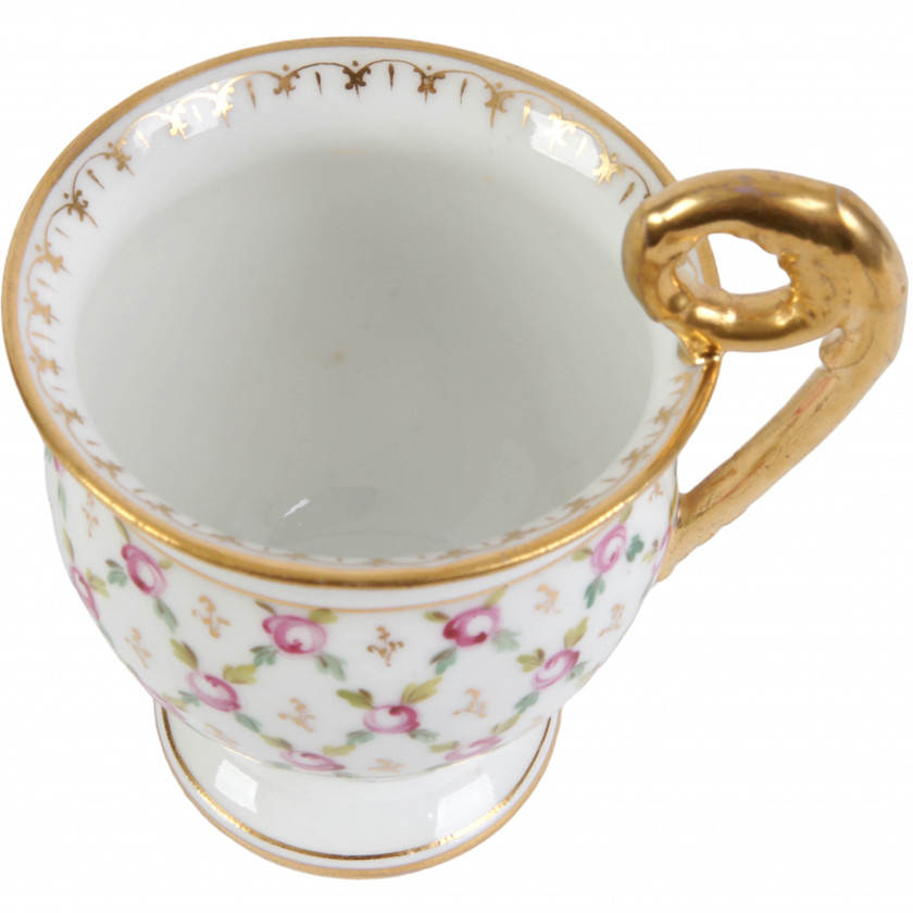 Porcelain tea cup and a saucer