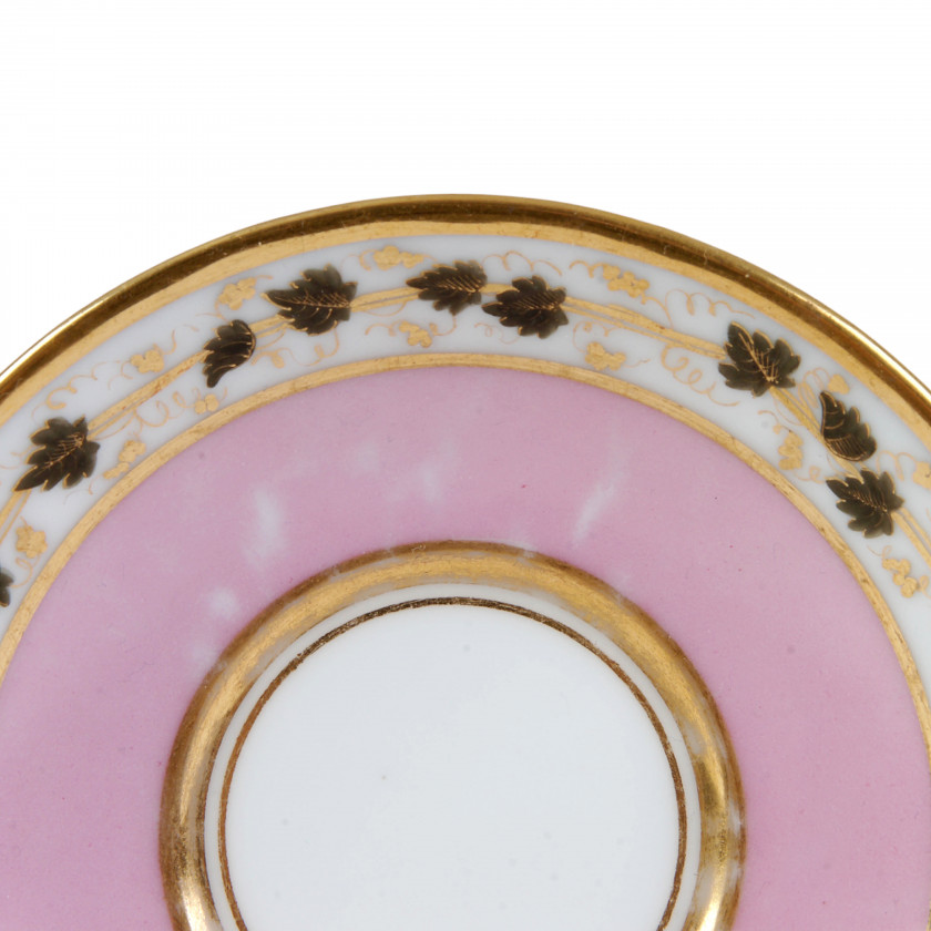 Porcelain tea cup and a saucer