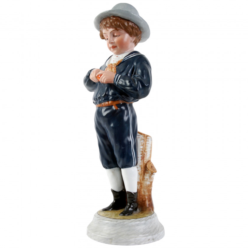 Porcelain figure "Boy peeling an orange"