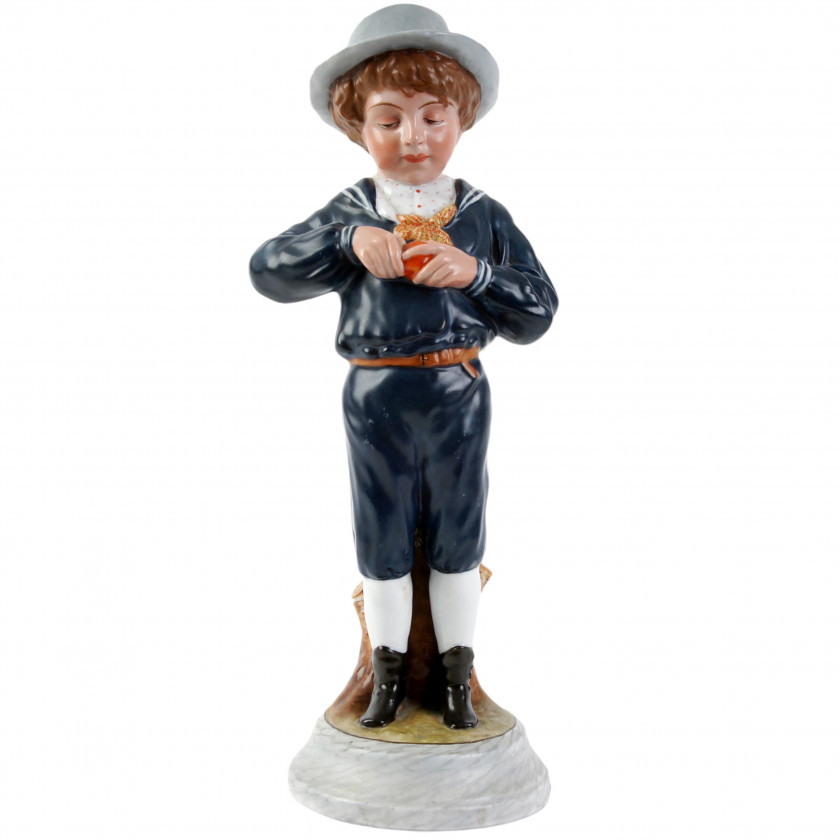 Porcelain figure "Boy peeling an orange"