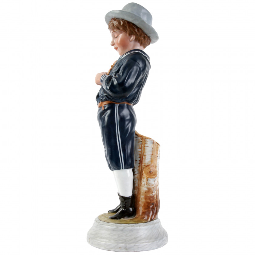 Porcelain figure "Boy peeling an orange"