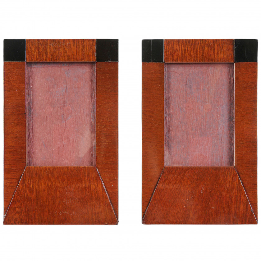 A pair of wooden photo frames