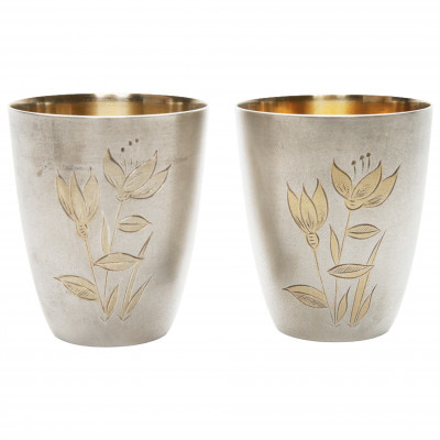 A pair of silver beakers