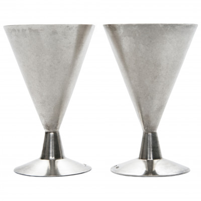 A pair of silver shot glasses